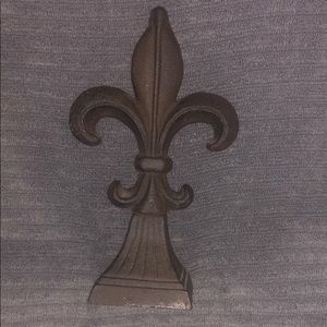 Metal fleur de lis statue
